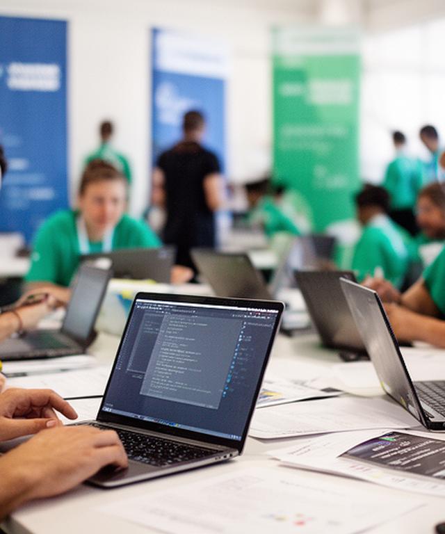 Acecore Data volunteers at a Louisiana community coding event with laptops, banners, and students collaborating
